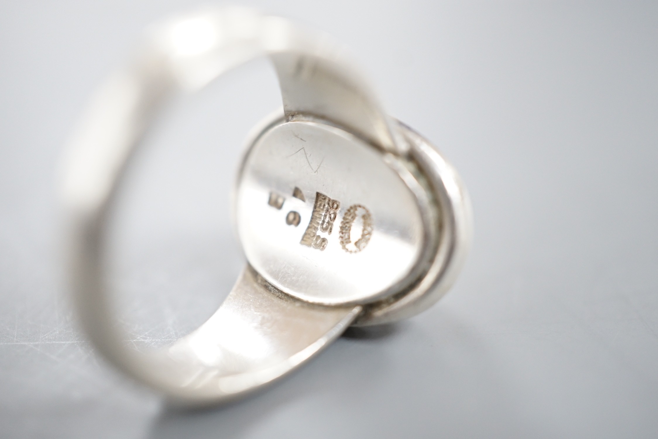 A Georg Jensen sterling 925 ring, no. 46B, size K/L and a pair of similar earrings, no.8.
